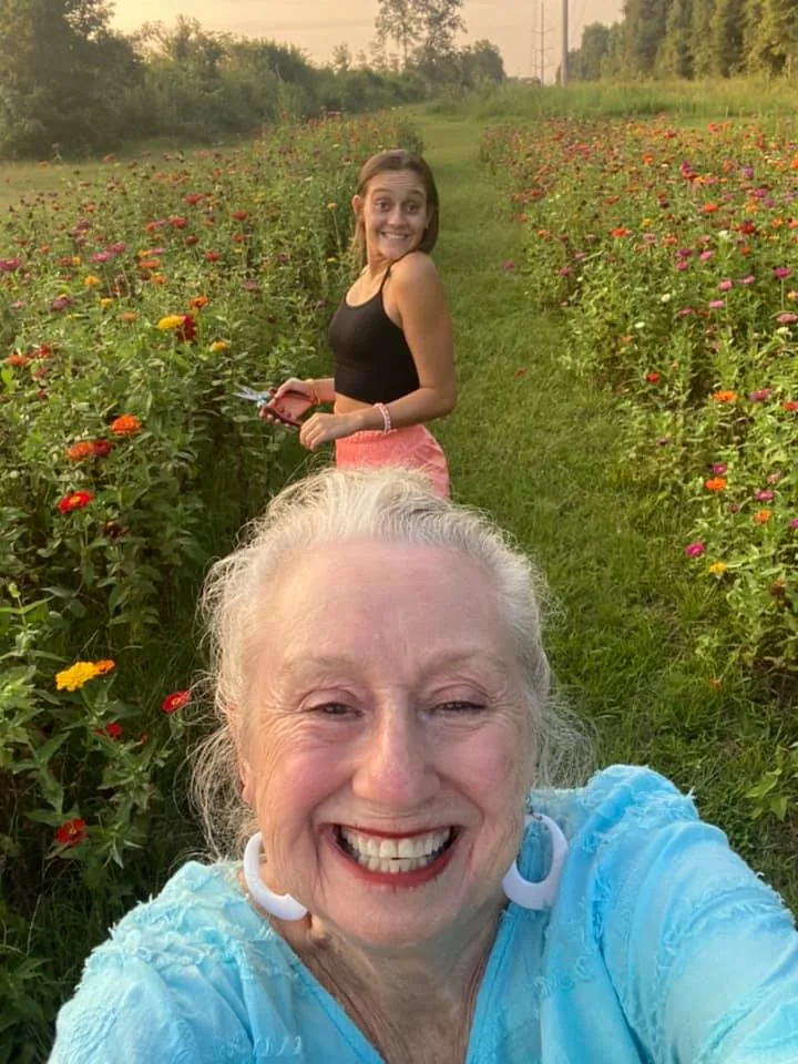 A cheerful outdoor moment among flowering plants