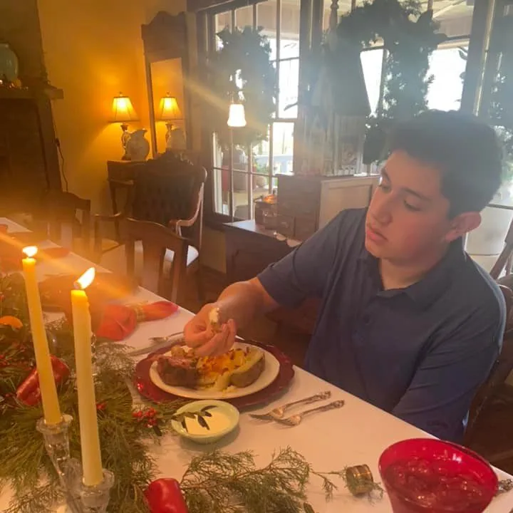 A kitchen table prepared for people to gather around food